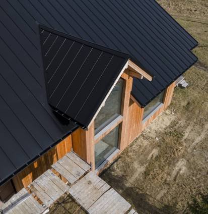 high-angle-beautiful-wooden-house-with-new-roof